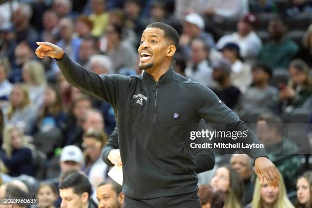 Head coach Kim English of the Providence Friars signals to his players during a college basketball game against the Villanova Wildcats at Wells Fargo...