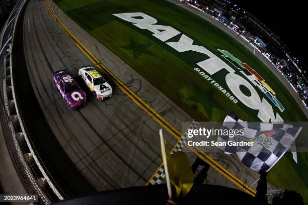 William Byron, driver of the Axalta Chevrolet, leads Alex Bowman, driver of the Ally Chevrolet, to the checkered flag to win the NASCAR Cup Series...