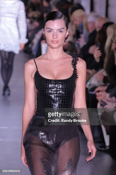 Emily Ratajkowski walks the runway during the Tory Burch Fall/Winter 2024 Fashion Week show at New York Public Library on February 12, 2024 in New...