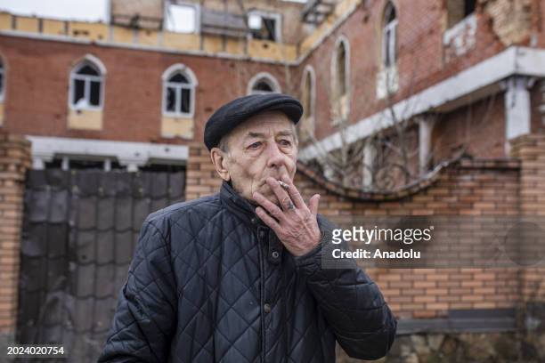 Citizen stands near residential buildings in Gostomel, a town located near Kyiv and it has been heavily impacted by the ongoing attacks, ahead of the...