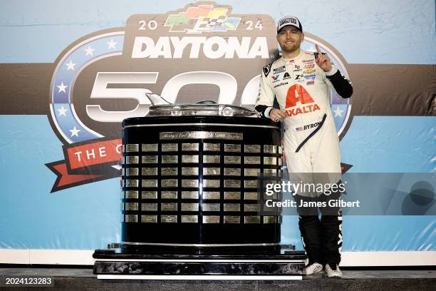 William Byron, driver of the Axalta Chevrolet, celebrates in victory lane after winning the NASCAR Cup Series Daytona 500 at Daytona International...