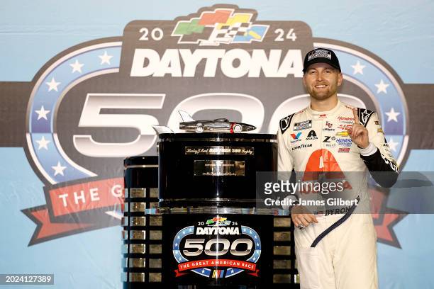 William Byron, driver of the Axalta Chevrolet, celebrates in victory lane after winning the NASCAR Cup Series Daytona 500 at Daytona International...