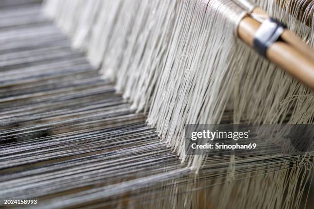 revealing rural art: it is a skill that requires skill in weaving to produce beautiful patterns. - thread loom stock pictures, royalty-free photos & images