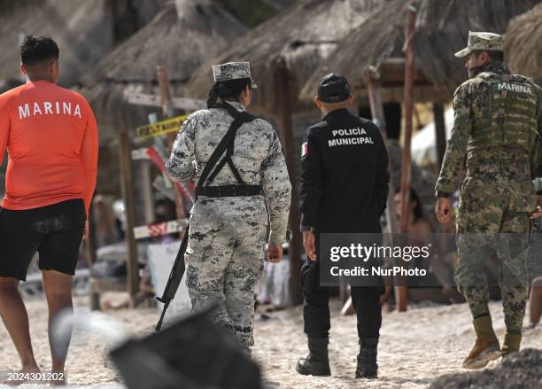 Mexican Marine, Police Municipal, and Mexican Army personnel patrolling the sandy shores of Puerto Morelos beach, on December 17 in Puerto Morelos,...