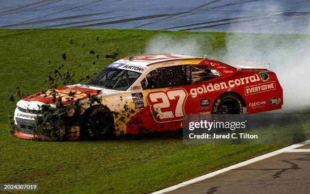 Jeb Burton, driver of the Golden Corral Chevrolet, spins into the infield grass after an on-track incident during the NASCAR Xfinity Series United...