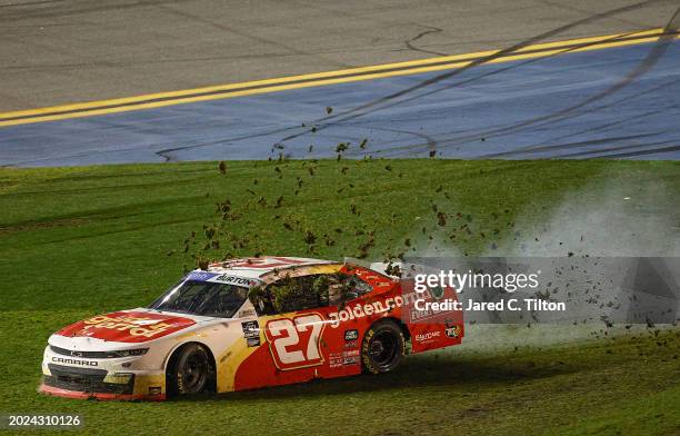 Jeb Burton, driver of the Golden Corral Chevrolet, spins into the infield grass after an on-track incident during the NASCAR Xfinity Series United...