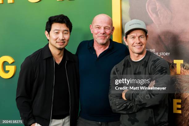 Simu Liu, Simon Cellan Jones, and Mark Wahlberg attend the Los Angeles special screening and adoption event for Lionsgate's "Arthur The King" at AMC...