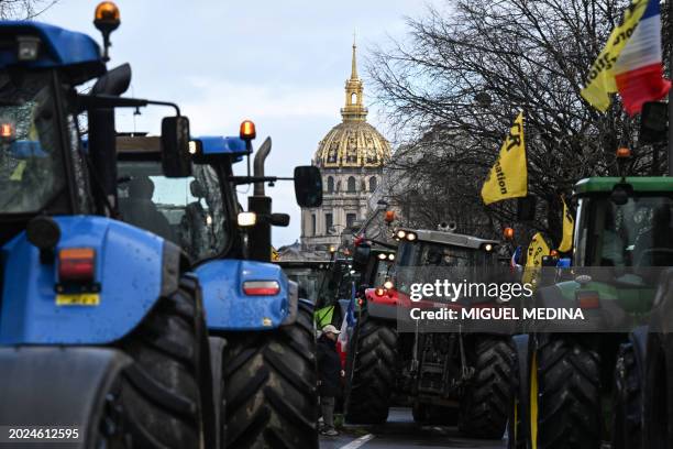 French farmers drive tractors during a demonstration of the Coordination Rurale agricultural union, ahead of the opening of the 60th International...