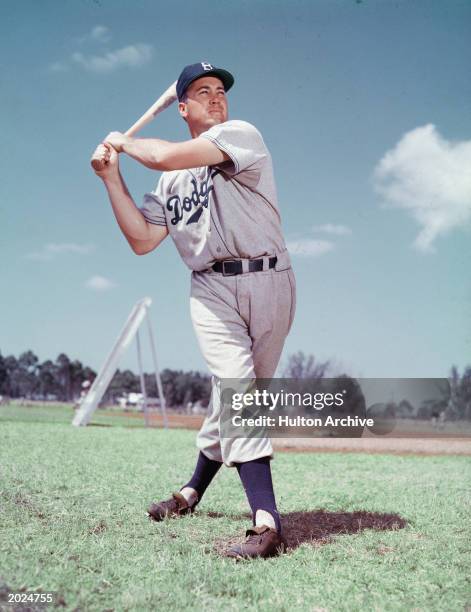 Full length portrait of American baseball player Duke Snider, sporting a Brooklyn Dodgers uniform and standing in a batting pose, circa 1955.