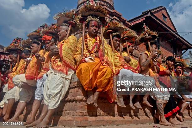 Hindu devotees take part in a religious procession on the occasion of Madhav Narayan festival in Bhaktapur on the outskirts of Kathmandu on February...