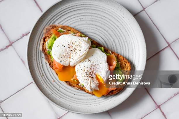 healthy breakfast from poached eggs and toast bread - avocato oil stock pictures, royalty-free photos & images