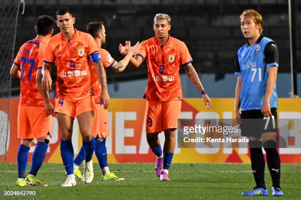 Cryzan of Shandong Taishan celebrates after scoring the team's third goal during the AFC Champions League Round of 16 second leg match between...