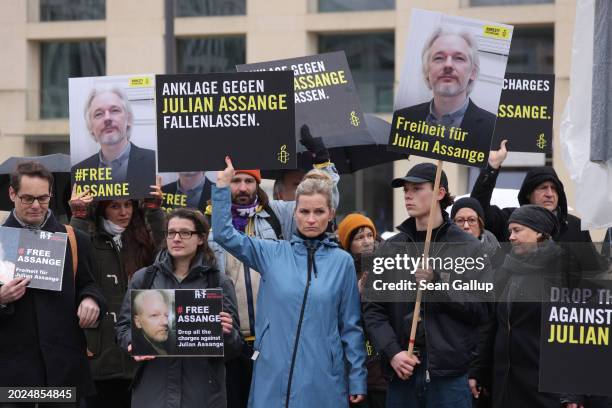 People gather with signs that read: Freedom for Julian Assange to demand freedom for Wikileaks founder Julian Assange on February 20, 2024 in Berlin,...