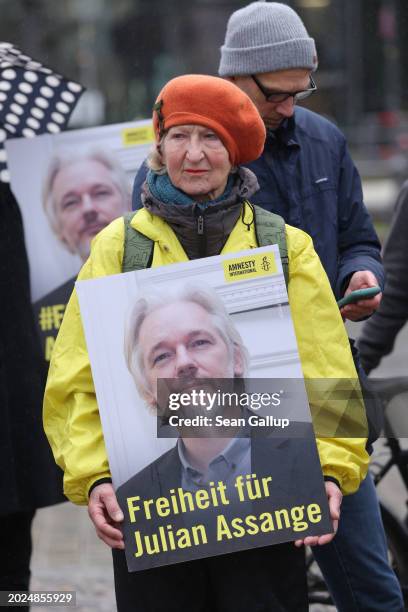 People gather with signs that read: "Freedom for Julian Assange" to demand freedom for Wikileaks founder Julian Assange on February 20, 2024 in...