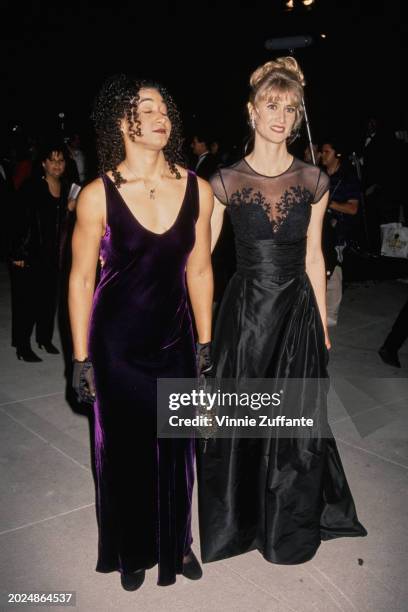 American actress Laura Dern and friend attend the Vanity Fair Oscar Party at Morton's Restaurant in West Hollywood, California, 21st March 1994.
