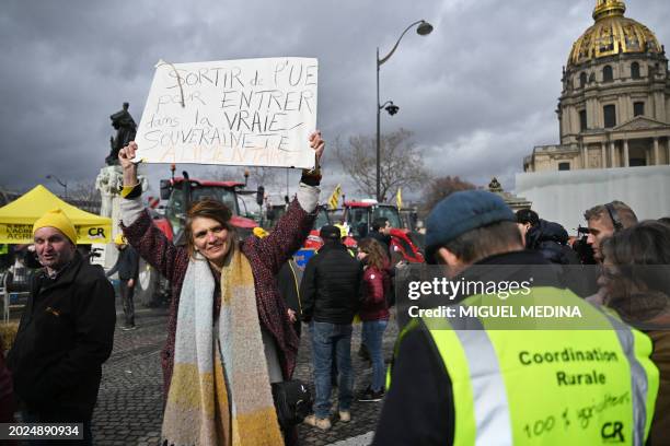 Protestor holds a placard reading "Leave EU to get into the real alimentary sovereignty" during a demonstration of French farmers of the Coordination...