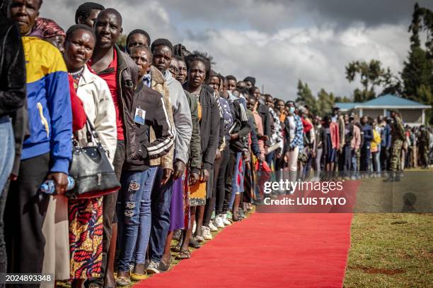 People queue to see the coffin of Kelvin Kiptum while attending the funeral proceedings of the late marathon runner in Chepkorio on February 23,...