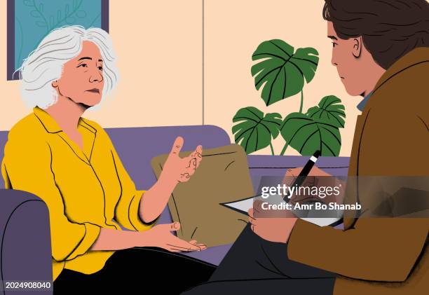 psychologist attentively listens to a patient during a therapy session. mental health, counseling, therapy, support, emotional well-being, depression, professional help - moving up to seated position stock pictures, royalty-free photos & images