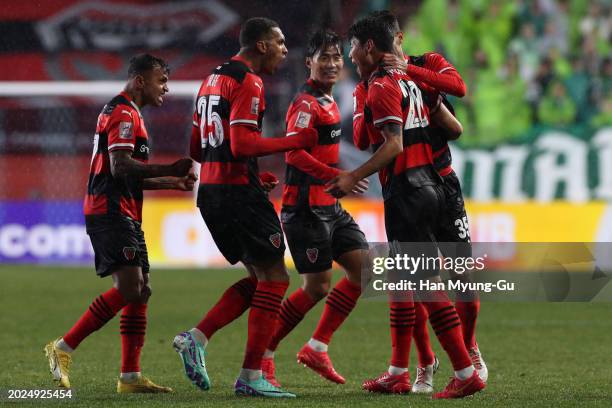 Park Chan-yong of Pohang Steelers celebrates with teammates after scoring the team's first goal during the AFC Champions League Round of 16 second...