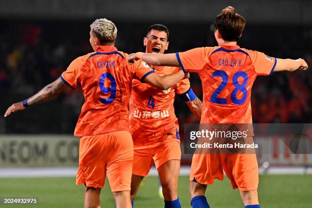 Cryzan, Jadson and Gao Zhunyi of Shandong Taishan celebrate the team's 6-5 aggregate victory following the 4-2 win in the AFC Champions League Round...