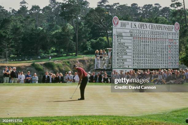 Tiger Woods from the United States follows his final putt on the 18th green to win the 100th United States Open golf tournament on 18th June 2000 at...