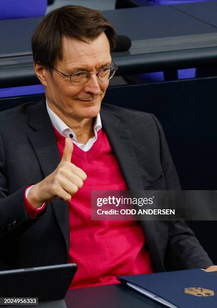 German Health Minister Karl Lauterbach gestures a thumb-up during a plenary session, as the parliament scheduled the vote on decriminalisation of...