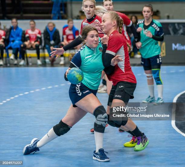 Alyona Len' №14 of HC Sumy-U fights for the ball against Anastasiya Parkhomenko №4 of HC Spartak Kyiv during the Women's Handball Cup of Ukraine...