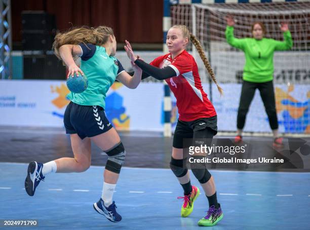 Anastasiya Parkhomenko №4 of HC Spartak Kyiv stops Isabella Balan №2 of HC Sumy-U from throwing the ball into the net during the Women's Handball Cup...