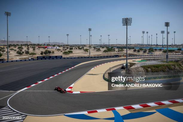 Ferrari's Spanish driver Carlos Sainz drives during the third day of the Formula One pre-season testing at the Bahrain International Circuit in...