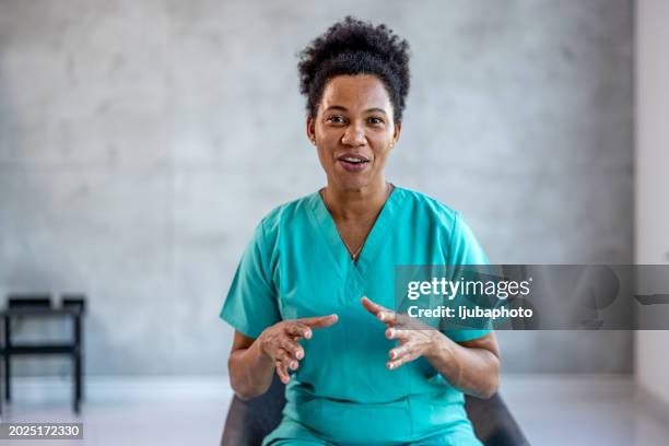 friendly young nurse physician gp working online, consulting patient. - female nurse stock pictures, royalty-free photos & images