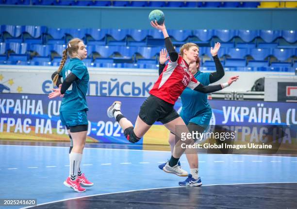Yuliya Nechayeva №66 of HC Spartak Kyiv fights for the ball against Victoria Tkachenko №10 and Daria Mygalenko №9 of HC Sumy-U during the Women's...