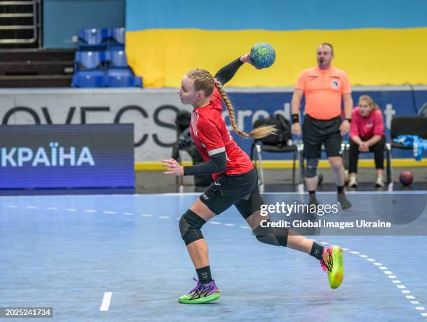 Anastasiya Parkhomenko №4 of HC Spartak Kyiv throws the ball, playing against HC Sumy-U players during the Women's Handball Cup of Ukraine 2023-2024...