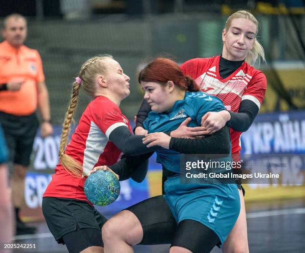 Daria Mygalenko №9 of HC Sumy-U fights for the ball against Anastasiya Parkhomenko №4 and Anastasia Orzhakhovska №55 of HC Spartak Kyiv during the...