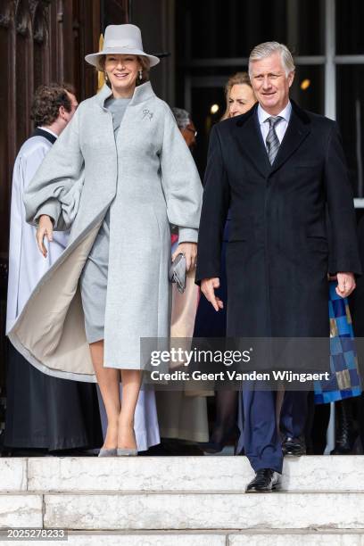 Queen Mathilde and King Philippe of Belgium greet people after the annual mass in memory of deceased members of the Belgian Royal Family at Eglise...