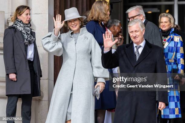 Queen Mathilde and King Philippe of Belgium greet people after the annual mass in memory of deceased members of the Belgian Royal Family at Eglise...