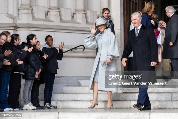 Queen Mathilde and King Philippe of Belgium greet people after the annual mass in memory of deceased members of the Belgian Royal Family at Eglise...