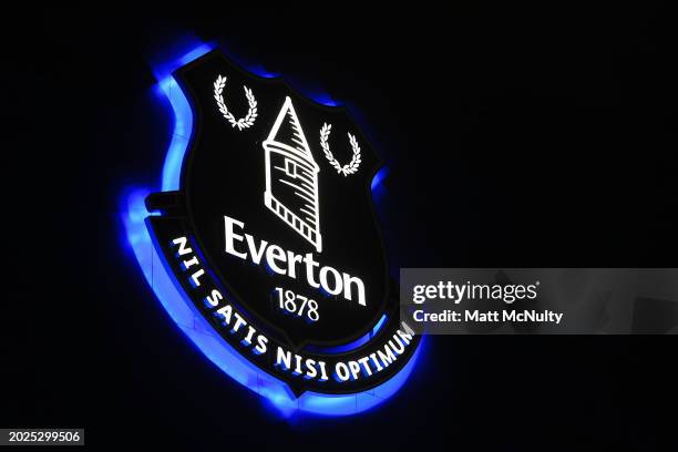 An Everton FC crest is illuminated on the stadium facade prior to the Premier League match between Everton FC and Crystal Palace at Goodison Park on...