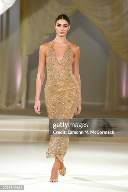 Model walks the runway at the Oh Polly Runway Show During London Fashion Week 2024 at St. John's Hyde Park on February 17, 2024 in London, England.