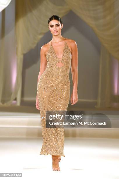 Model walks the runway at the Oh Polly Runway Show During London Fashion Week 2024 at St. John's Hyde Park on February 17, 2024 in London, England.