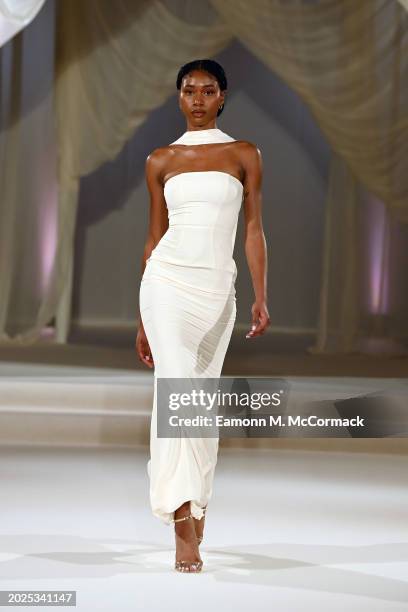 Model walks the runway at the Oh Polly Runway Show During London Fashion Week 2024 at St. John's Hyde Park on February 17, 2024 in London, England.