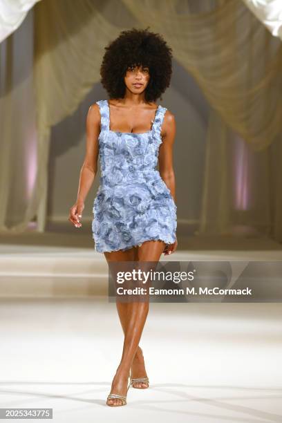 Model walks the runway at the Oh Polly Runway Show During London Fashion Week 2024 at St. John's Hyde Park on February 17, 2024 in London, England.