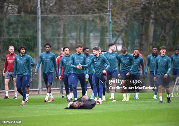 Arsenal players walk out before a training session at London Colney on February 20, 2024 in St Albans, England.