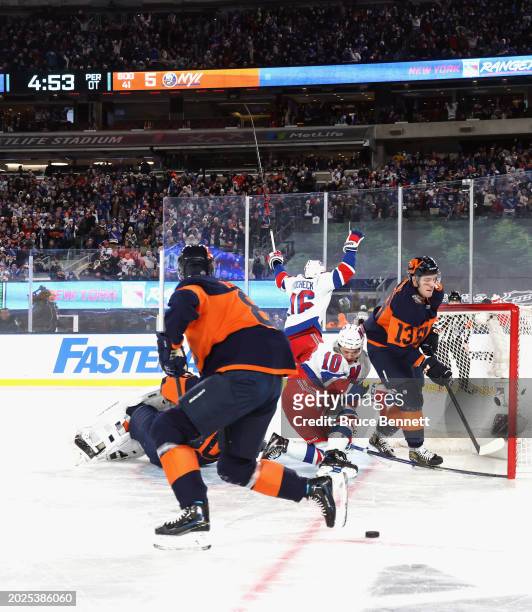 Artemi Panarin of the New York Rangers score sthe game-winning goal in overtime against the New York Islanders during the 2004 Navy Federal Credit...