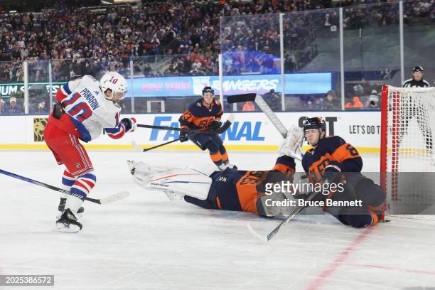 Artemi Panarin of the New York Rangers score sthe game-winning goal in overtime against the New York Islanders during the 2004 Navy Federal Credit...