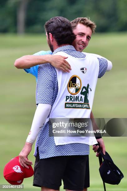 David Puig of Spain hugs his caddie Alberto Sanchez after winning the tournament during day four of the IRS Prima Malaysian Open at The MINES Resort...