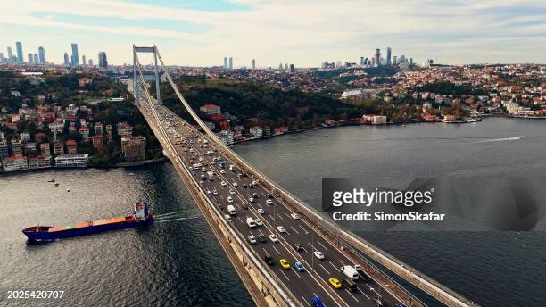 high angle drone view of vehicles on bosphorus bridge over marmara sea by cityscape at istanbul,turkey - van turkey stock pictures, royalty-free photos & images