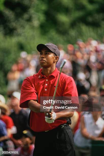 Tiger Woods from the United States follows the course of his iron shot on the fairway during the 61st US Masters Tournament on 13th April 1997 at...