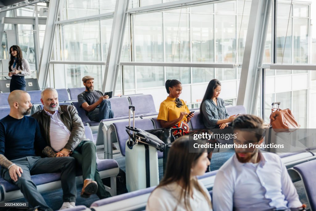 Passengers Waiting In An Airport Lounge
