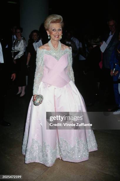 American philanthropist Barbara Davis, wearing a pink evening gown with silver trim, attends the 10th Carousel of Hope Ball, held at the Beverly...