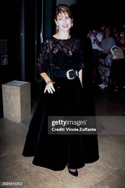 American actress Pam Dawber, wearing a black evening gown, attends Chesebrough-Ponds' 5th Annual National Hero Awards, held at the Waldorf-Astoria in...